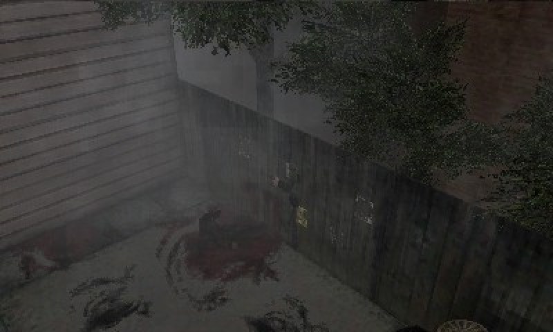 A back alley of the town under thick fog, with a bloodstain on the ground, on the 3DS’s top screen